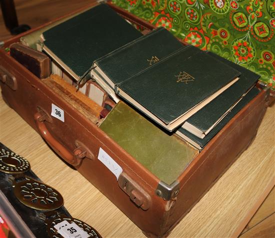 A suitcase of mixed leather bound books